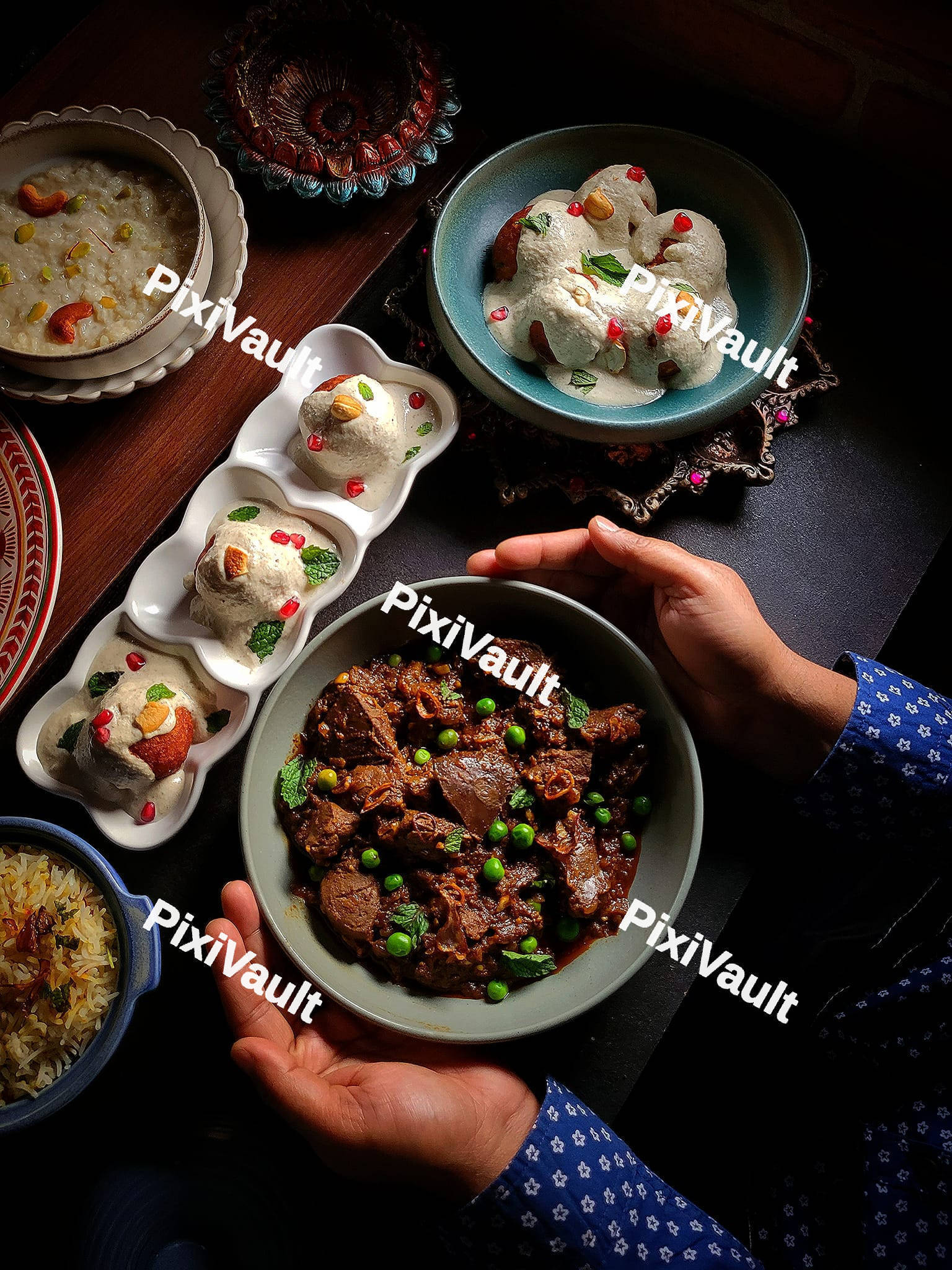 A person holding a bowl with beef stew